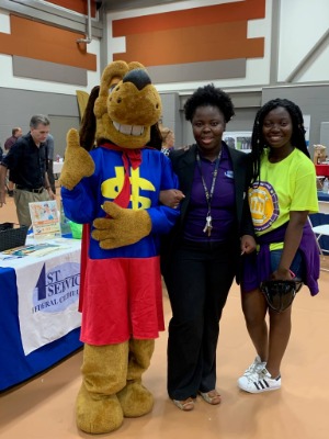 Dollar Dog with bank employee and student